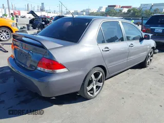 2005 Mitsubishi Lancer ES with VIN JA3AJ26E25U017526, listed as a IAAI auction lot 41680488 with 166,175 mi miles. Bid and sale history available at carsss.com. Image 4.
