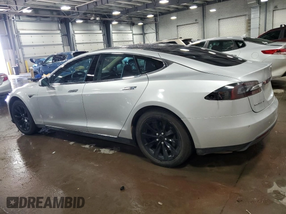 2014 Tesla Model S 60 with VIN 5YJSA1H15EFP51239, listed as a Copart auction lot 59214485 with 153,554 mi miles and Salvage title. Bid and sale history available at DreamBid. Image 2.