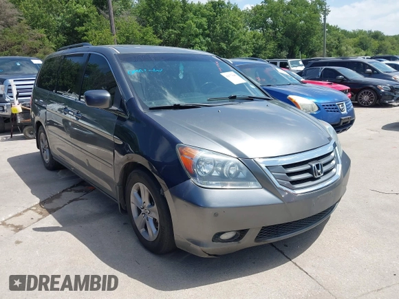 2010 Honda Odyssey Touring with VIN 5FNRL3H90AB053710, listed as a IAAI auction lot 42577646 with 255,351 mi miles and . Bid and sale history available at DreamBid. Image 1.