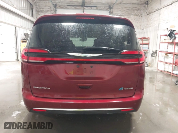 2021 Chrysler Pacifica Hybrid Touring L with VIN 2C4RC1L71MR581260, listed as a IAAI auction lot 42014401 with 68,719 mi miles and . Bid and sale history available at DreamBid. Image 16.