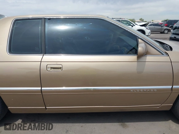 1999 Cadillac Eldorado ESC z VIN 1G6EL12Y5XU603764, wystawiony jako IAAI lot #42368692 z przebiegiem 154 613 mil mil oraz . Historia ofert i sprzedaży dostępna na DreamBid. Obrazek 13.
