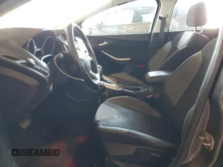 2012 Ford Focus SE with VIN 1FAHP3F28CL114572, listed as a Copart auction lot 63053035 with 142,994 mi miles and Salvage title. Bid and sale history available at DreamBid. Image 7.