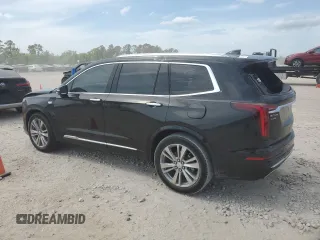 2023 Cadillac XT6 FWD Premium Luxury with VIN 1GYKPCRS6PZ127331, listed as a Copart auction lot 52951105 with 47,796 mi miles and Salvage Title. Bid and sale history available at carsss.com. Image 2.