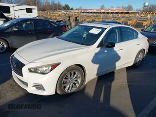 2014 Infiniti Q50 Hybrid Sport with VIN JN1AV7AP5EM690406, listed as a IAAI auction lot 41306387 with 143,309 mi miles and . Bid and sale history available at DreamBid. Image 19.