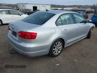 2014 Volkswagen Jetta Sedan SE w/Connectivity/Sunroof PZEV with VIN 3VWD17AJ5EM362888, listed as a IAAI auction lot 41787904 with 143,332 mi miles. Bid and sale history available at carsss.com. Image 4.