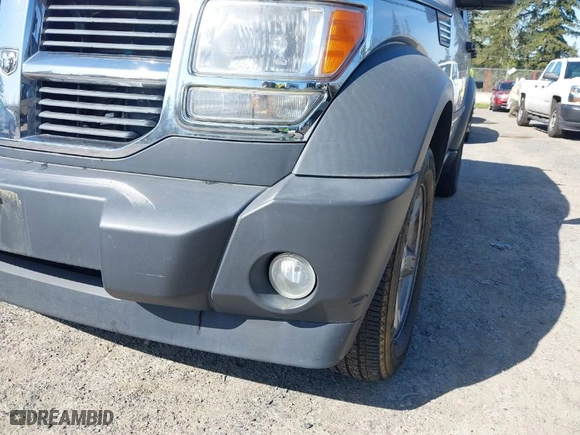 2007 Dodge Nitro SXT with VIN 1D8GU28K87W581969, listed as a IAAI auction lot 42036088 with 128,382 mi miles. Bid and sale history available at carsss.com. Image 6.