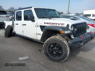 2021 Jeep Gladiator Mojave with VIN 1C6JJTEG0ML609125, listed as a IAAI auction lot 41570165 with 42,071 mi miles and . Bid and sale history available at DreamBid. Image 1.