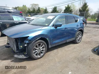 2019 Mazda CX-5 Signature with VIN JM3KFBEY1K0512880, listed as a IAAI auction lot 42036904 with 92,650 mi miles. Bid and sale history available at carsss.com. Image 2.