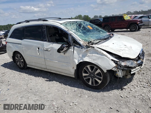 2014 Honda Odyssey Touring with VIN 5FNRL5H98EB053486, listed as a Copart auction lot 58004225 with 201,526 mi miles and Salvage title. Bid and sale history available at DreamBid. Image 4.