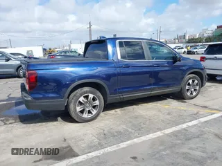 2017 Honda Ridgeline RTL-T with VIN 5FPYK2F68HB001759, listed as a IAAI auction lot 41562343 with 59,633 mi miles and . Bid and sale history available at DreamBid. Image 4.