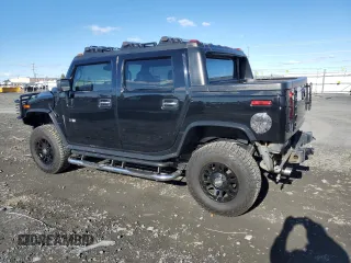 2005 Hummer H2 SUT with VIN 5GRGN22U55H112442, listed as a Copart auction lot 86158414 with 135,411 mi miles and Salvage Title. Bid and sale history available at carsss.com. Image 2.