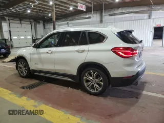 2017 BMW X1 xDrive28i with VIN WBXHT3Z34H4A54811, listed as a Copart auction lot 63584405 with 92,699 mi miles and Salvage title. Bid and sale history available at DreamBid. Image 2.