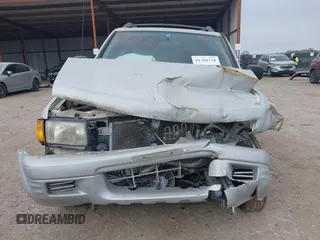 1999 Isuzu Rodeo S with VIN 4S2CK58W4X4358898, listed as a IAAI auction lot 41360738 with 184,948 mi miles and . Bid and sale history available at carsss.com. Image 12.