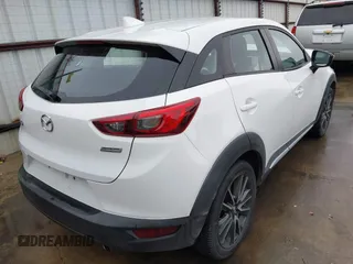 2016 Mazda CX-3 Grand Touring with VIN JM1DKBD73G0124742, listed as a IAAI auction lot 41448684 with 96,322 mi miles. Bid and sale history available at carsss.com. Image 4.