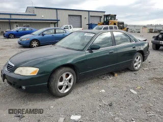 2001 Mazda Millenia with VIN JM1TA221011708952, listed as a Copart auction lot 64995014 with Not Provided miles and Salvage Title. Bid and sale history available at DreamBid. Image 1.