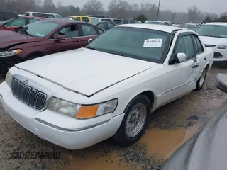 2001 Mercury Grand Marquis LS with VIN 2MEFM75W41X672360, listed as a IAAI auction lot 41418594 with 73,717 mi miles and . Bid and sale history available at DreamBid. Image 2.