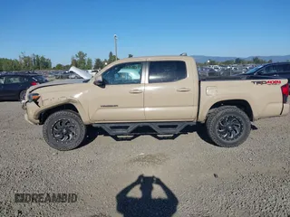 2018 Toyota Tacoma SR z VIN 3TMCZ5AN7JM125425, wystawiony jako IAAI lot #40459066 z przebiegiem 85 182 mil mil oraz . Historia ofert i sprzedaży dostępna na DreamBid. Obrazek 14.