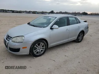 2009 Volkswagen Jetta z VIN 3VWAL71K69M089925, wystawiony jako Copart lot #87891115 z przebiegiem 116 547 mil mil oraz Szkoda całkowita • Salvage title. Historia ofert i sprzedaży dostępna na DreamBid. Obrazek 1.