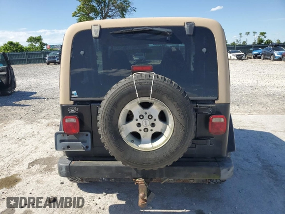 2001 Jeep Wrangler Sahara with VIN 1J4FA59S71P343366, listed as a Copart auction lot 57826405 with 156,436 mi miles and Salvage title. Bid and sale history available at DreamBid. Image 6.