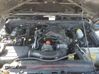 2013 Jeep Wrangler Unlimited Freedom z VIN 1C4BJWDG0DL513902, wystawiony jako Copart lot #52045975 z przebiegiem 166 827 mil mil oraz Szkoda całkowita • Salvage title. Historia ofert i sprzedaży dostępna na DreamBid. Obrazek 11.