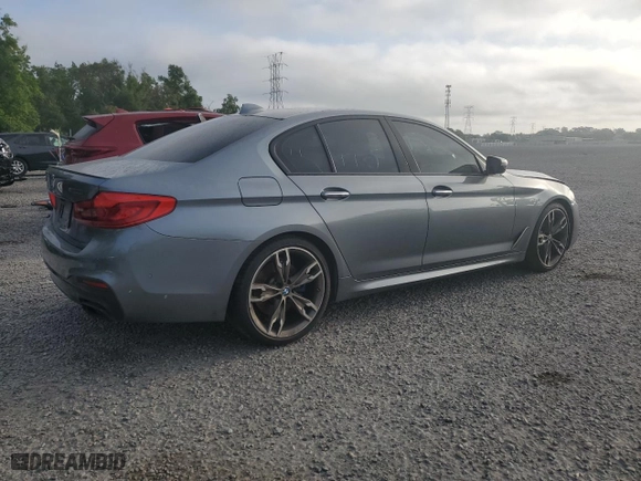 2018 BMW 5 Series M550i xDrive with VIN WBAJB9C50JB287269, listed as a Copart auction lot 52031765 with 100,592 mi miles and Clean Title. Bid and sale history available at carsss.com. Image 3.