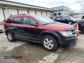 2013 Dodge Journey SE with VIN 3C4PDCAB3DT723547, listed as a Copart auction lot 48140495 with 159,979 mi miles and Salvage title. Bid and sale history available at DreamBid. Image 4.
