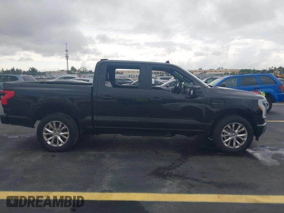 2023 Ford F-150 Lightning Pro with VIN 1FT6W1EV3PWG08587, listed as a IAAI auction lot 42418036 with Not provided miles and . Bid and sale history available at DreamBid. Image 12.
