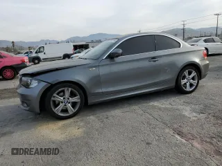 2012 BMW 1 Series 128i with VIN WBAUP9C52CVL91861, listed as a Copart auction lot 83647764 with 136,735 mi miles and Salvage title. Bid and sale history available at DreamBid. Image 1.