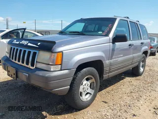 1996 Jeep Grand Cherokee with VIN 1J4EZ58S5TC149533, listed as a IAAI auction lot 42456529 with 173,872 mi miles and . Bid and sale history available at DreamBid. Image 2.