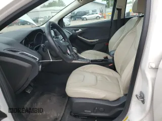 2016 Ford Focus Titanium z VIN 1FADP3N23GL345904, wystawiony jako Copart lot #60139525 z przebiegiem 97 572 mil mil oraz Szkoda całkowita • Salvage title. Historia ofert i sprzedaży dostępna na DreamBid. Obrazek 7.