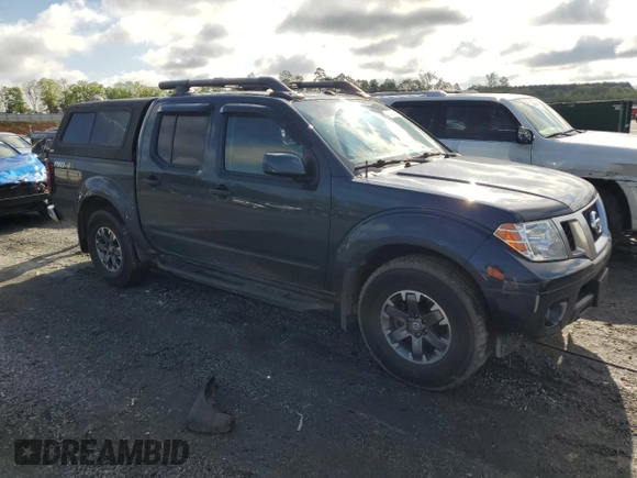 2018 Nissan Frontier Pro-4X with VIN 1N6DD0EV5JN702214, listed as a Copart auction lot 52802715 with 79,837 mi miles and Salvage title. Bid and sale history available at DreamBid. Image 4.