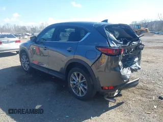 2020 Mazda CX-5 Grand Touring with VIN JM3KFBDM1L0821975, listed as a IAAI auction lot 40088794 with 68,895 mi miles and . Bid and sale history available at DreamBid. Image 3.