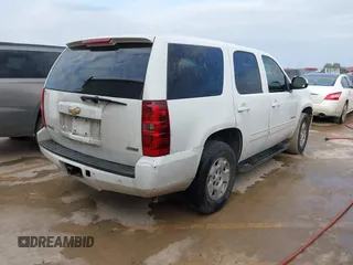 2010 Chevrolet Tahoe LS with VIN 1GNMCAE3XAR215407, listed as a IAAI auction lot 41570899 with 197,401 mi miles and . Bid and sale history available at DreamBid. Image 4.