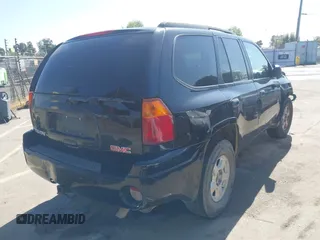 2004 GMC Envoy SLE with VIN 1GKDS13S942294303, listed as a IAAI auction lot 41992547 with 196,444 mi miles. Bid and sale history available at carsss.com. Image 4.
