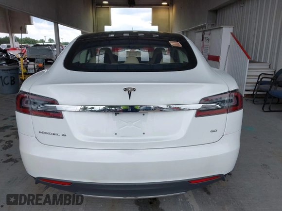 2014 Tesla Model S 60 with VIN 5YJSA1S16EFP53350, listed as a IAAI auction lot 42239753 with 104,985 mi miles and . Bid and sale history available at DreamBid. Image 16.