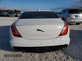 2018 Jaguar XJ with VIN SAJWA1C77J8W14750, listed as a Copart auction lot 87273204 with 51,040 mi miles and Clean Title. Bid and sale history available at carsss.com. Image 6.