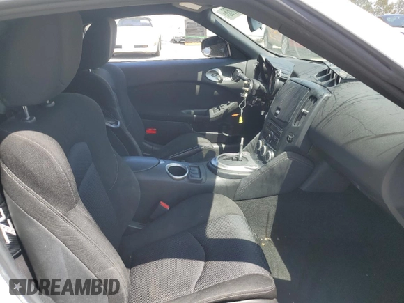 2012 Nissan 370Z z VIN JN1AZ4EH1CM562134, wystawiony jako Copart lot #56708065 z przebiegiem Nie podano mil oraz Szkoda całkowita • Salvage title. Historia ofert i sprzedaży dostępna na DreamBid. Obrazek 10.
