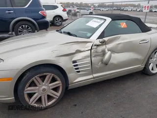 2006 Chrysler Crossfire Limited z VIN 1C3AN65L16X066010, wystawiony jako IAAI lot #41003432 z przebiegiem 95 926 mil mil oraz . Historia ofert i sprzedaży dostępna na DreamBid. Obrazek 6.