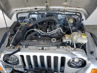 2006 Jeep Wrangler Rubicon with VIN 1J4FA69S26P734731, listed as a Copart auction lot 52009295 with 117,872 mi miles and Salvage title. Bid and sale history available at DreamBid. Image 11.