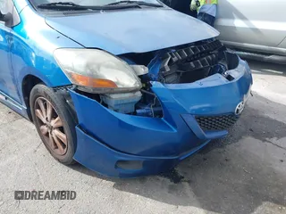 2009 Toyota Yaris with VIN JTDBT903591323255, listed as a IAAI auction lot 41933401 with 88,558 mi miles and . Bid and sale history available at DreamBid. Image 12.