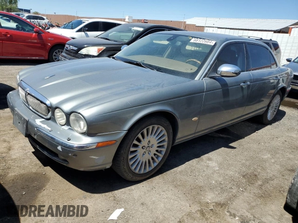 2006 Jaguar XJ Vanden Plas with VIN SAJWA82BX6SH09069, listed as a Copart auction lot 68122604 with 153,999 mi miles and Salvage Title. Bid and sale history available at carsss.com. Image 1.