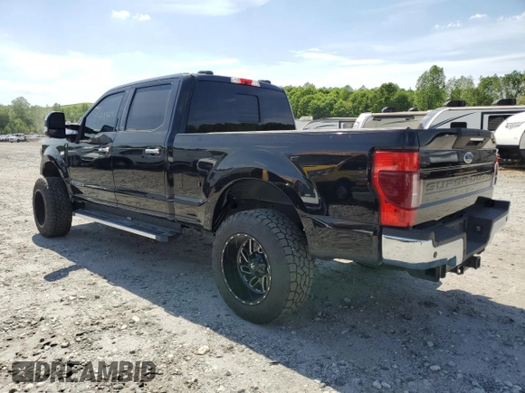 2021 Ford Super Duty F-250 SRW XL with VIN 1FT7W2BT1MEC51277, listed as a Copart auction lot 54199165 with 99,324 mi miles and Salvage Title. Bid and sale history available at carsss.com. Image 2.