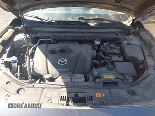 2020 Mazda CX-5 Grand Touring with VIN JM3KFBDM1L0821975, listed as a IAAI auction lot 40088794 with 68,895 mi miles and . Bid and sale history available at DreamBid. Image 10.