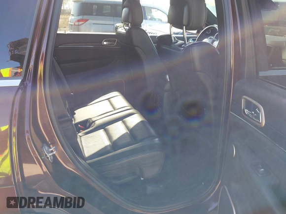 2015 Jeep Grand Cherokee Summit with VIN 1C4RJFJGXFC125131, listed as a IAAI auction lot 42475017 with 128,166 mi miles and . Bid and sale history available at DreamBid. Image 8.