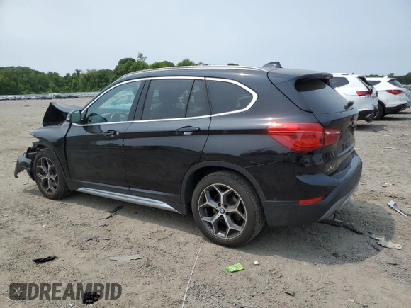 2018 BMW X1 xDrive28i with VIN WBXHT3C36J3H29952, listed as a Copart auction lot 59679285 with 75,220 mi miles and Salvage title. Bid and sale history available at DreamBid. Image 2.