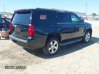 2015 Chevrolet Tahoe LT with VIN 1GNSCBKC8FR268891, listed as a IAAI auction lot 41964602 with 175,035 mi miles and . Bid and sale history available at DreamBid. Image 4.