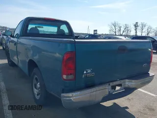 1998 Ford F-150 with VIN 1FTZF1723WNC12776, listed as a IAAI auction lot 41599872 with 125,007 mi miles and . Bid and sale history available at DreamBid. Image 3.