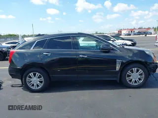 2013 Cadillac SRX Premium Collection with VIN 3GYFNEE34DS535613, listed as a IAAI auction lot 42336365 with 106,426 mi miles and . Bid and sale history available at DreamBid. Image 14.