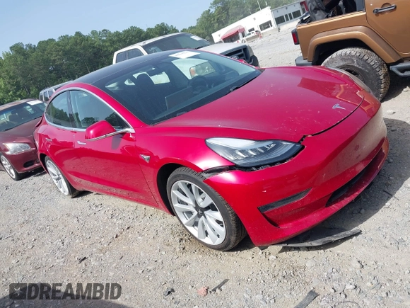 2020 Tesla Model 3 Standard Range Plus with VIN 5YJ3E1EA9LF708808, listed as a IAAI auction lot 40018323 with 32,069 mi miles. Bid and sale history available at carsss.com. Image 1.