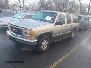 1999 GMC Suburban with VIN 1GKFK16R4XJ799354, listed as a IAAI auction lot 41696999 with 269,606 mi miles. Bid and sale history available at carsss.com. Image 2.